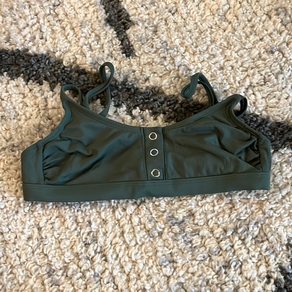 Simsuit top. Brand is Xhilaration from Target. Adjustable straps. Womens Size S.